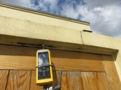 Elevated moisture readings and deterioration to direct fix plaster cladding 